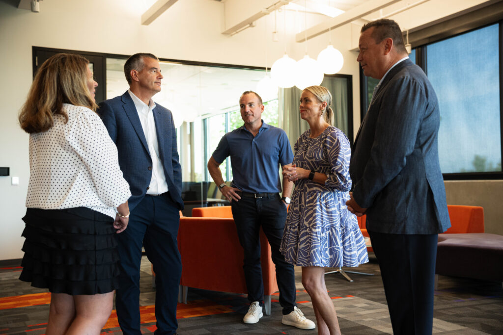 L to R: Kristin Geppert – AVP, Business Development/Shareholder, Jeff Wilson, Captive Insurance Director with the Iowa Department of Insurance and Financial Services, Nick Blyth –SVP/Shareholder, Stephani Manning – President/Shareholder, Tom Stewart – President, PLUS/Shareholder